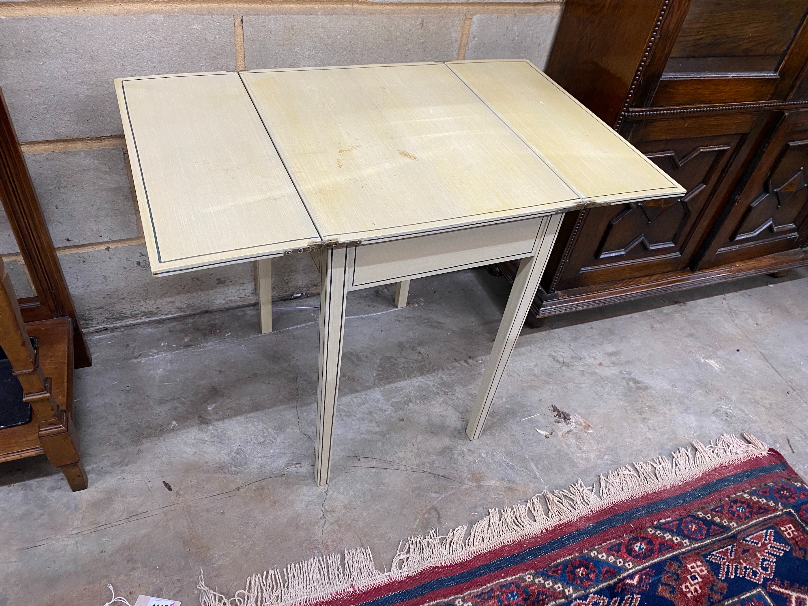 A painted side table with hinged twin flap top, width 39cm, depth 50cm, height 63cm